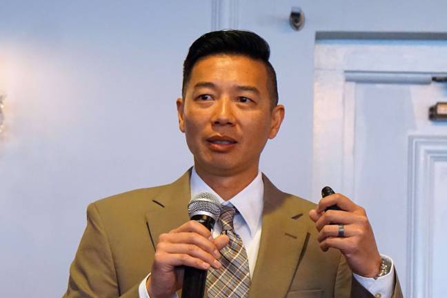 PHOTO BY VERA OLINSKI Strategic Intelligence Analyst Kevin Wong reviews the impacts of marijuana legalization on C.O.