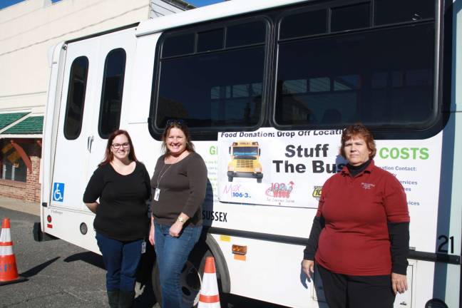 Social Services employees Tina Adamsky and Susan Bowman along with busdriver Mary Ann Warner at Saturday&#x2019;s Stuff the Bus event at the former Carl&#x2019;s Auto Body Shop in Lake Mohawk. Photos by Rose Sgarlato
