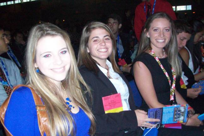 Wallkill Valley FBLA members Mikayla Savastano and Carly DeOliveira, along with Jackson Memorial FBLA member Jamie Casella, await the beginning of the Opening Session at the 2015 FBLA National Leadership Conference.