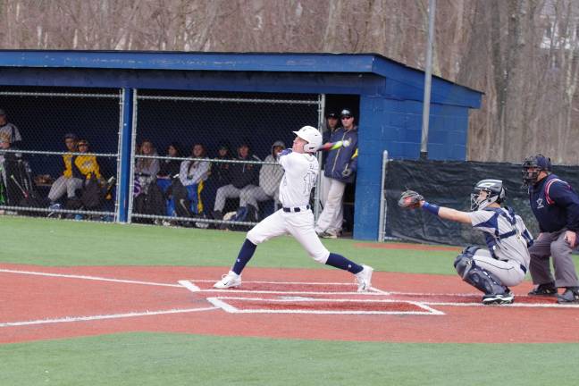 Pope John batter Joe Millar plops it up in the sixth inning. Millar scored one run.