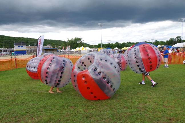 There was a series of inflatable attractions for the children including Knocker Ball, which enabled the children to climb into inflatable balls and bowl each other across the field.