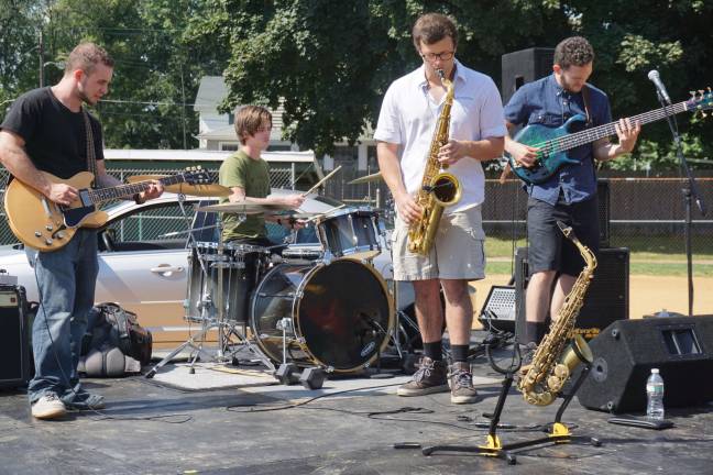 The smooth jazz sounds of Inner Vision breeze across the field, from left, Tim Deaver, Zack Fischer, Sean Farrelly and Jamie Heston.