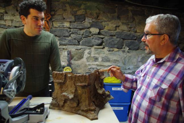 Marshall Okin, left, is shown with his father Sandy of Okin Design in the workshop studios below Art Etc in Hamburg. On the table between them is a column section that is currently under restoration. The senior Okin sees this particular project as a perfect representation of their collaboration of improving the old yet preserving the history of Hamburg.