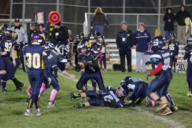 Sparta Blue Pony and Vernon Pony battle on the field. Sparta won the game by the score of 20-7.