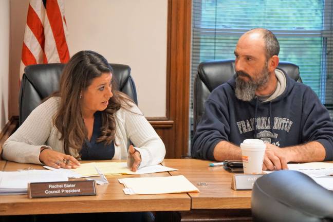 PHOTOS BY VERA OLINSKI From left, Council President Rachel Slater discusses Heater's Pond information as Councilman Anthony Nasisi listens.