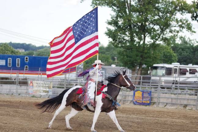 Bucking broncos at the NJ State Fair Old Glory on display.