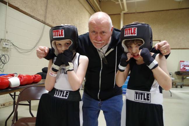 Dover Boxing Club owner Ed Leahy with grandson Daniel Leahy, 9, of Byram, and his opponent eight year old Rex Borgenicht, of Montclair.