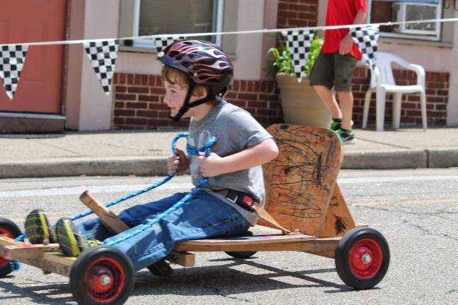 Cub Scout pack hosts annual mobile derby Tiger scout Jason J makes his way down.