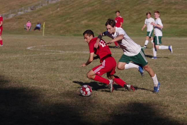 Sussex Tech Mustangs A High Point Wildcat and Sussex Tech Mustang pursue the ball.