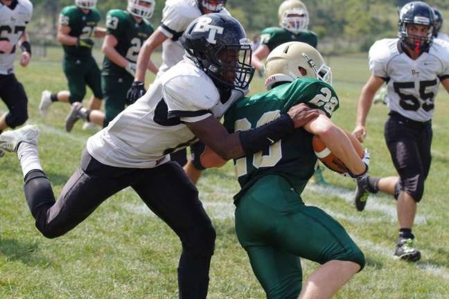 A Bergen Tech Knight grabs a Sussex Tech Mustang.