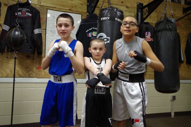 From left thirteen-year-old Kevin Pereira of, Randolph, nine-year-old Daniel Leahy, of Byram, and thirteen-year-old Alejandro Verdun, of Budd Lake, represent a new generation of boxers.