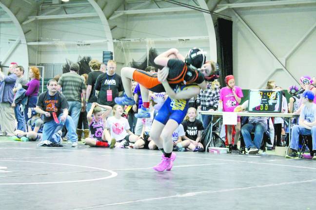 Female athlete competes in national wrestling competition Marlee Smith of Wantage during nationals.