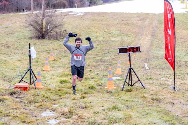 Matthew Moran, 32, of Bloomingdale crosses the finish line first for the second year in a row. His time was 35:30.6.
