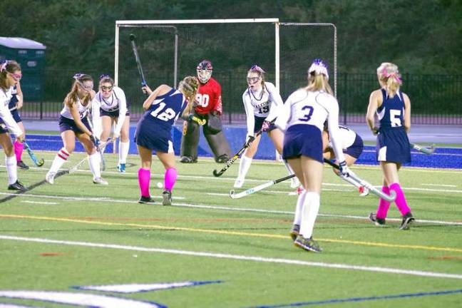 Jefferson tops Pope John in field hockey The Jefferson Falcons defend their goal post from the Pope John Lions.