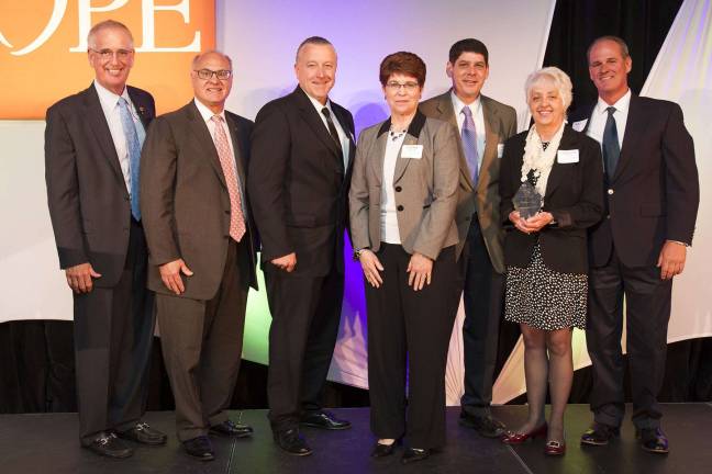 From left, Joe Sheridan, executive vice president at Wakefern Food Corp., congratulates the RoNetco Supermarkets team of Dominick J. Romano, Dan Dobrzynski, Cathie Miller, John Reinhart, Christine Foster and Bill Candler for their accomplishments.