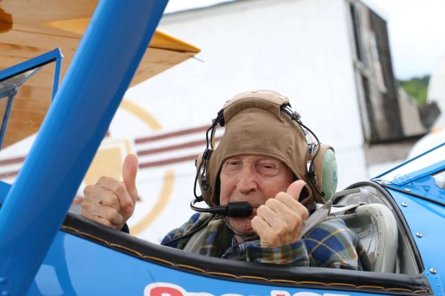 Vets soar at Sussex Airport Lawrence Spulick gives the thumbs up as he is ready to take his flight.