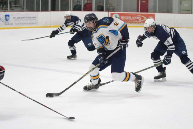 Sparta-Jefferson United's Spencer Schroepher steers the puck in the first period.