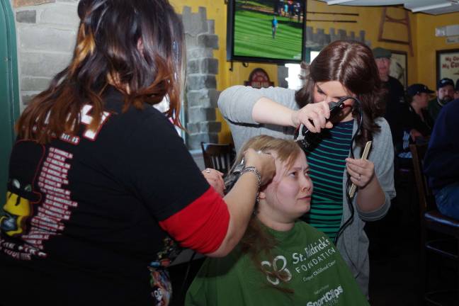 Close cuts for kids with cancer At center, Hamburg resident Lisa Peterson, not only had her head shaved to benefit St. Baldrick's, but she also donated her ponytail to the Locks of Love organization so that it could be used by a child recovering from chemotherapy. Her haircutters were Lake Panorama resident haircutter Stacy Dolan of Franklin's Rumours II, left, and Highland Lakes resident Maureen Casselli of Prohaircutters of Rockaway.