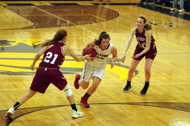 Jefferson's Victoria Pietraszkiewicz moves the ball between two Newton defenders in the fourth period.