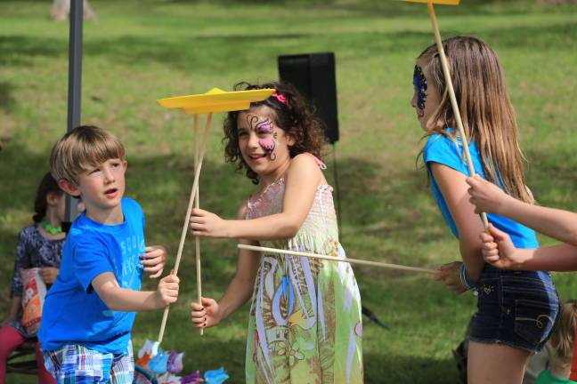 Community comes out for child battling condition Learning plate spinning with Muggle Juggle.