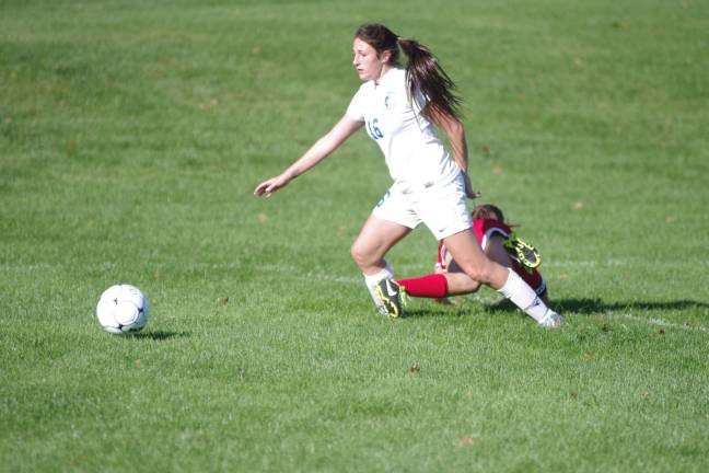 Kittatinny's Ally Benziger moves towards the ball as her opponent falls to the ground. Benziger contributed one assist.