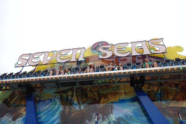 Summer fun at the Franklin Carnival The Seven Seas ride tosses riders’ hair into the air.