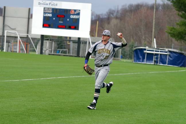 Jefferson's Sean Perry tossing in the ball after making catch to end the fifth inning.