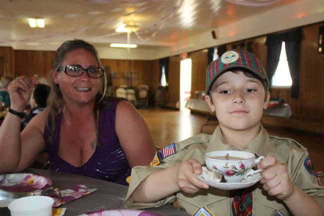 Cub Scouts host Mother's Day Tea Randy Nagy serves tea to his mom