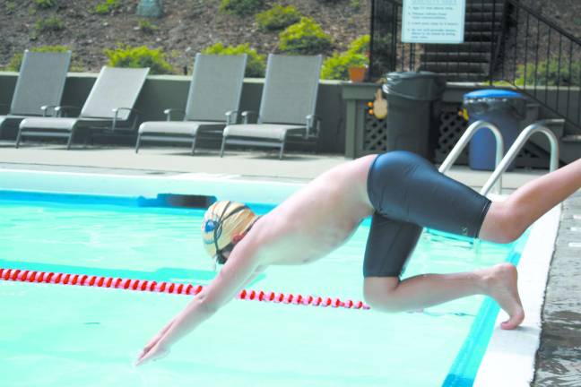 Michael O'Krepky dives in to the pool.