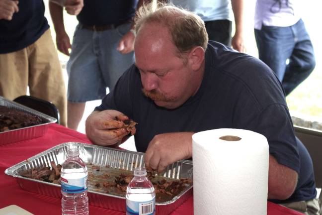 Sussex Fire Department firefighter T.J. Donnelly stepped up to the plate at the fourth annual Rock, Ribs and Ridges Rib Eating Contest to defeat favorite and three-time winner Hunter Space of the Beemerville Fire Department.