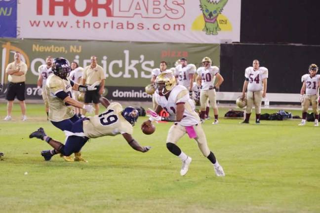 Sussex Stags stomp the Plattsburgh NorthStars The Northstars quarterback Jared Croy on the run from the Stags defense.