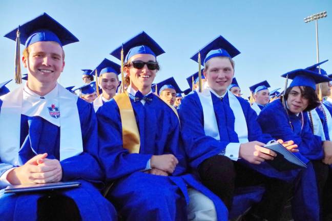 Vernon Township High School graduates front row from left are Benjamin Anderson, Samuel Woods, Jack Grosser and Rogelio Hernandez.