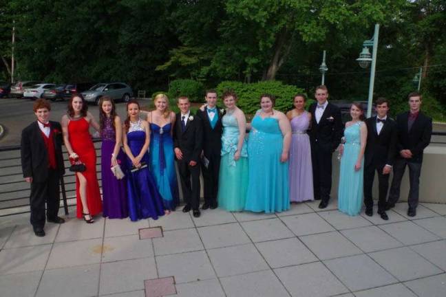 Prom-goers pose for a photo.
