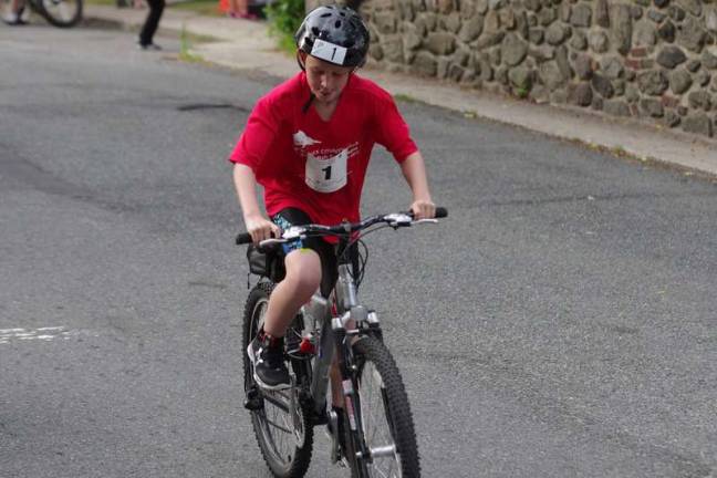 Swim, cycle, run Will Englehardt, 11, of Sparta, finished in 3rd place in the male 19 and under category with an overall time of 1:52:34.69.