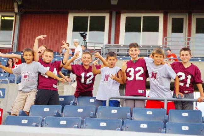 Sussex Stags stomp the Plattsburgh NorthStars Players from the Newton Youth Football League pose for a portrait. The Newton Braves players and families, came out and helped cheer on the Sussex Stags.