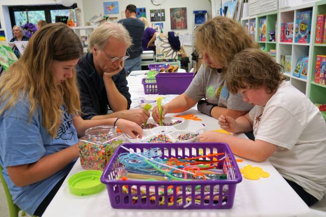 Painted grape celebrates 2 years in business The Widney family enjoys crafts together at the Painted Grape.