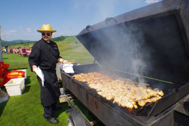 Crystal Springs Beer Fest brings together the best of two worlds Executive Banquet Chef Andy Macalion cooks up a few chicken legs.