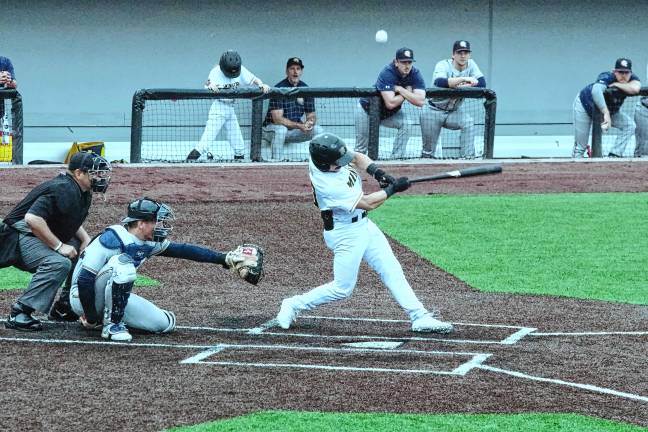 Miners leading division <b>Miners batter Will Zimmerman hits the ball into foul territory in the third inning.</b>