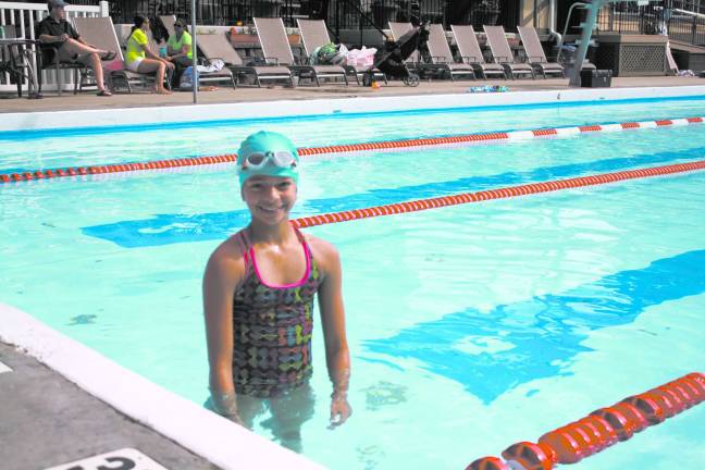 Volunteer group hosts swim-a-thon Participant Yasmeen Caswell, 12, swam 50 laps.