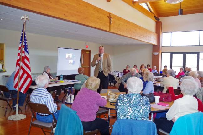 PHoto by Chris Wyman Sheriff's Department Internal Affairs Director/retired Sparta Police Department Detective Sergeant John Schanstra introduces the presentation&#xed;s segment on preventing burglaries.