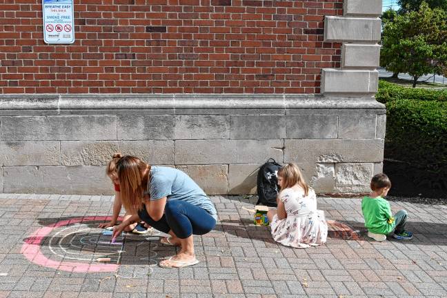 Photos: Chalk the Walk in Ogdensburg Megan and Adalyn Shenise, at left, take part in the second annual Chalk the Walk sponsored by the Ogdensburg PTO.