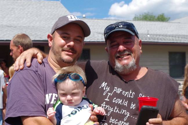 Representing three generations of Highland Lakes residents is the Sampogna family. From the left are Joe Jr., nine-month-old Joey III, and Joe Sr. According to Joe Sr., Joey won the cutest baby contest.