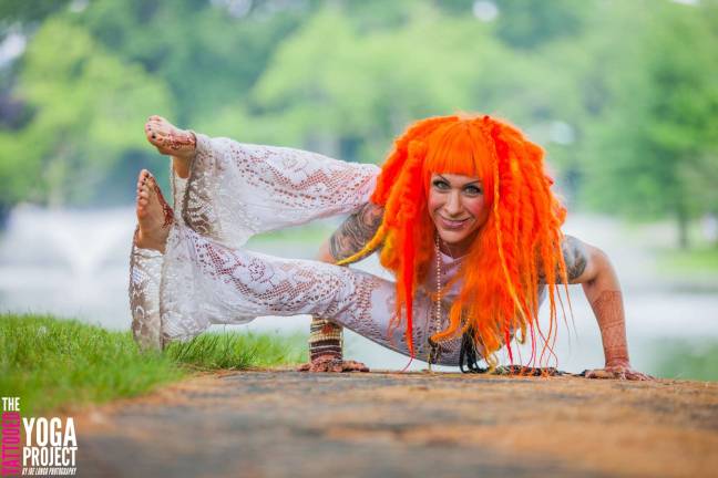 Photo by Joe Longo Sparta native Hallie Hawkins poses in a Eight Angle Pose (Astavakrasana).