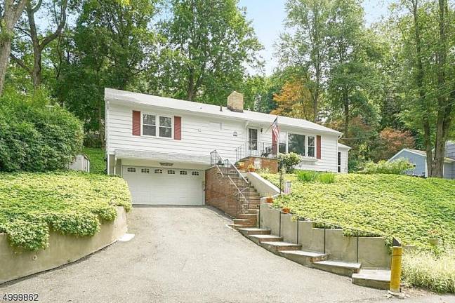 Enjoy your privacy at this beautifully maintained home on Lake Mohawk