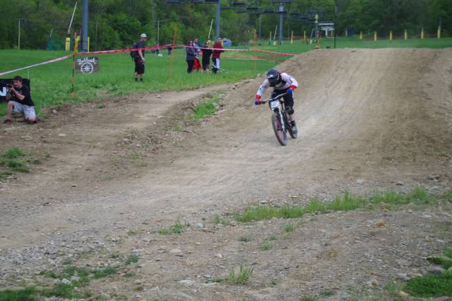 Mountain Creek hosts mountain biking event Local Pro Racer George Ryan of Vernon is shown airborne then returning to the ground during Sundayís professional racing circuit held at Mountain Creek. Ryan placed 12th in a field of 61 professional racers in the men's division.