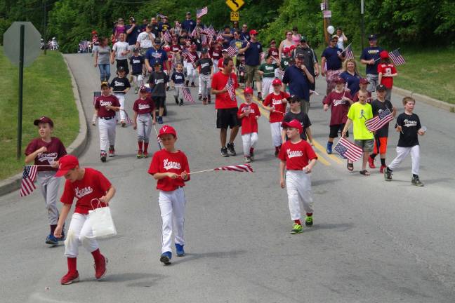 Township’s annual veteran’s tradition continues Members of Vernon Little League march during the parade.