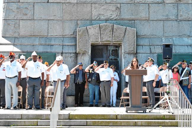 Photos: High Point Veterans Memorial Service <b>Veterans salute as Mariana Segura sings the National Anthem.</b>