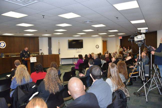 Newton Police Chief Michael Richards addresses the audience at C.L.E.A.R's anniversary press conference