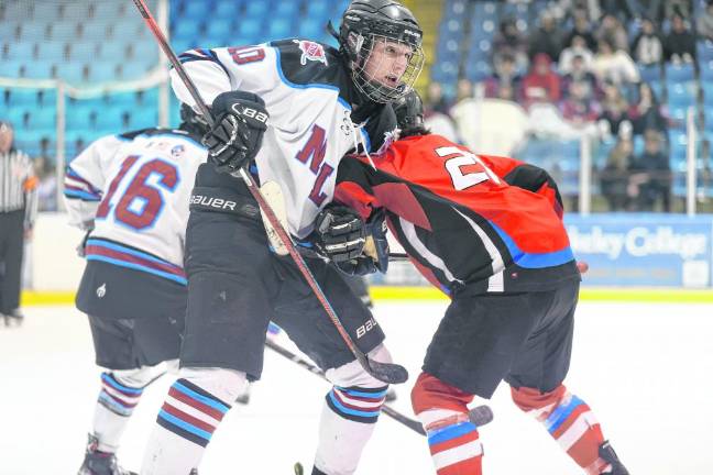 Senior Justin Zappe of N/LV wrestles with a High Point player after a faceoff.