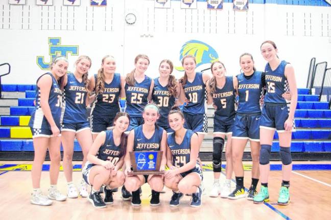 The Jefferson Falcons pose with their trophy after winning the North Jersey, Section 1, Group 2 final.